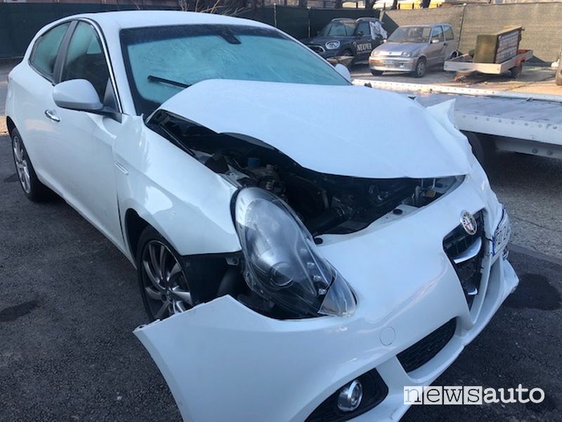 Car crashed with damaged bumper and bonnet